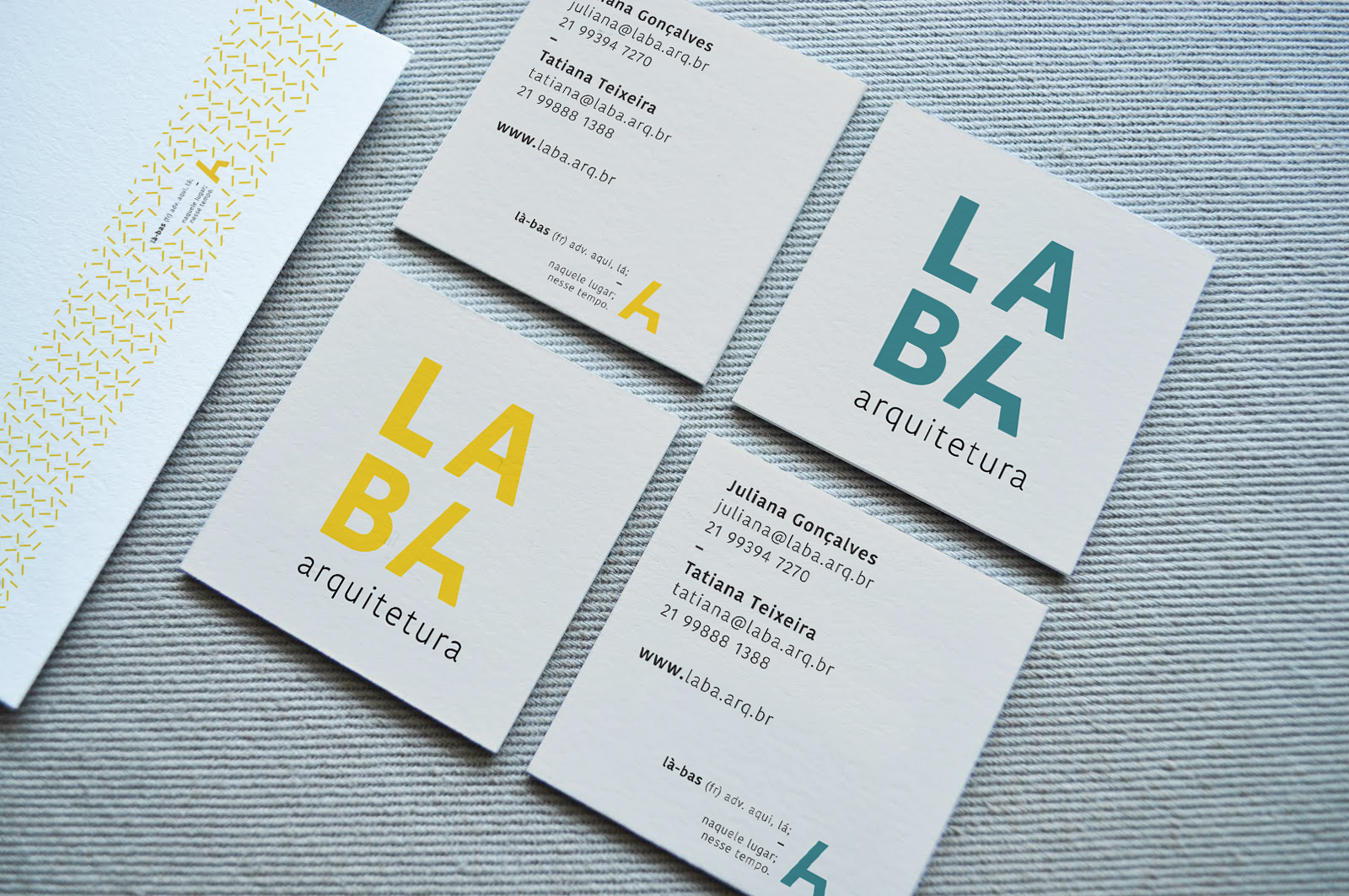 Photo montage showing the business cards and the branded envelope.